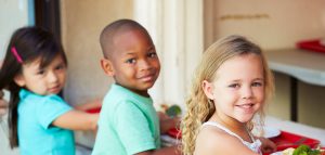 three kids smiling